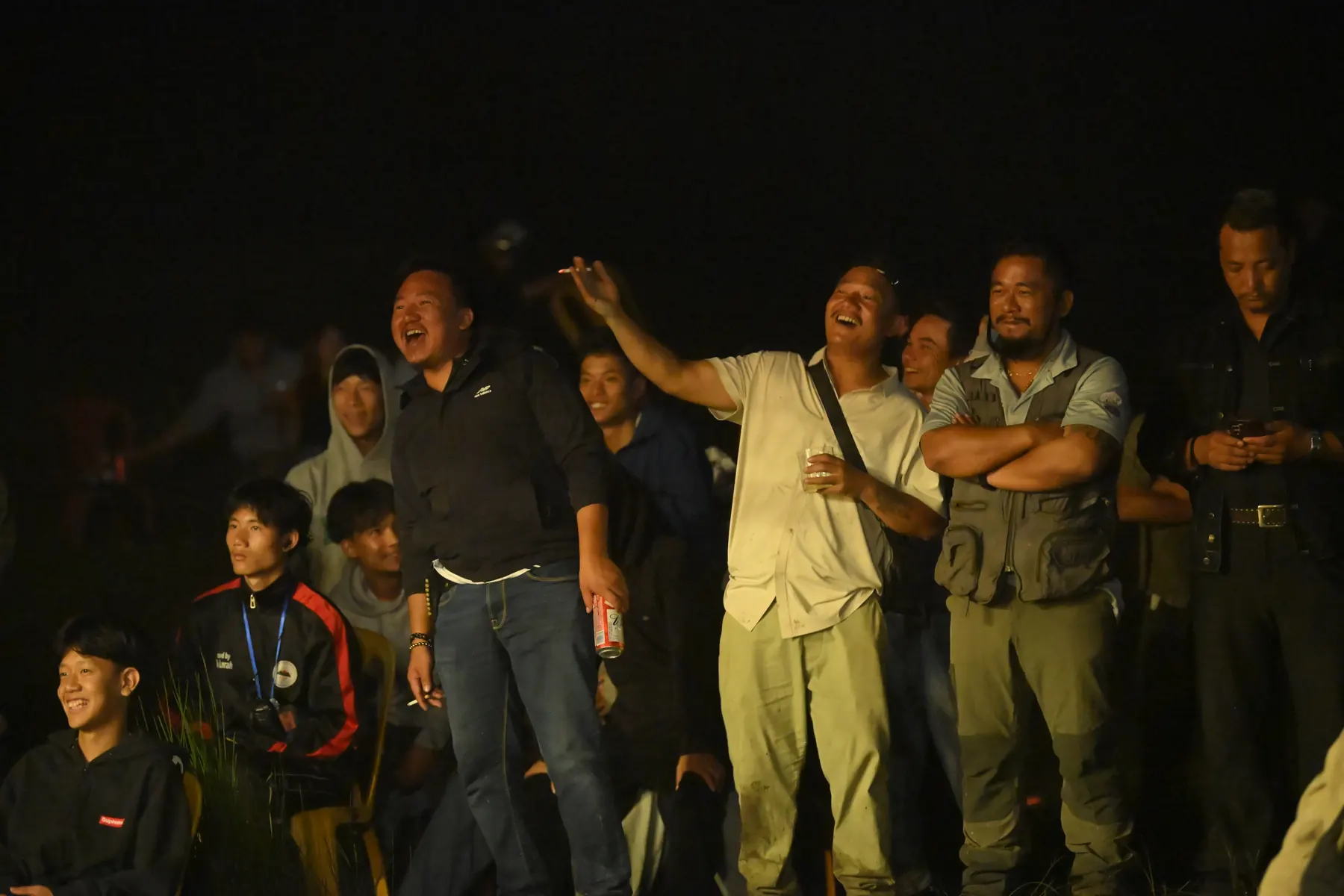 People gathered on a stage at night.